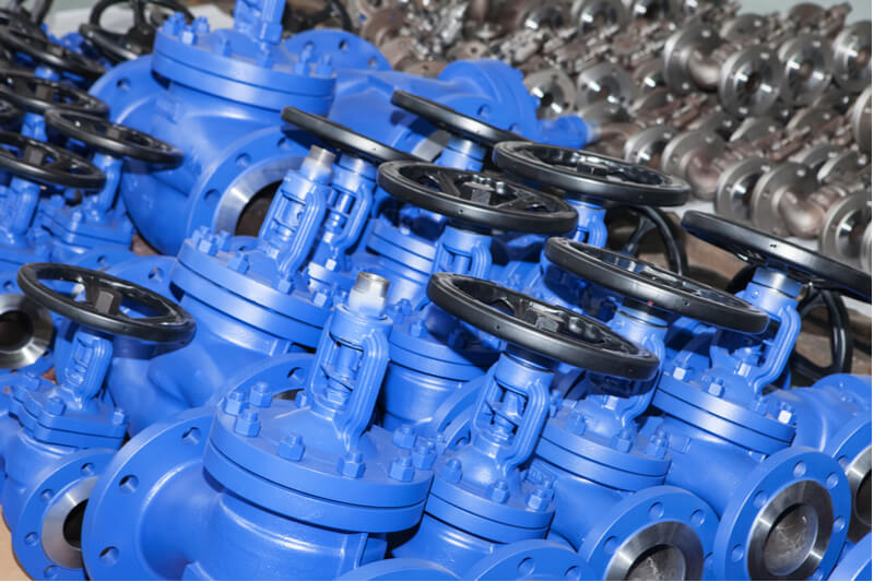 rows of blue colored industrial valves