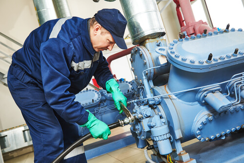 service engineer worker repairing and adjusting equipment
