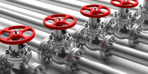 Industrial pipelines and valves with red wheels on white background.