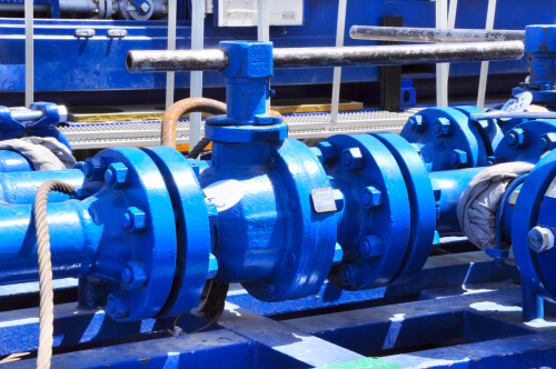 Ball valves in blue in the open air
