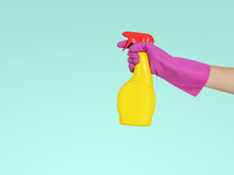 Person-Holding-Cleaning-Supply