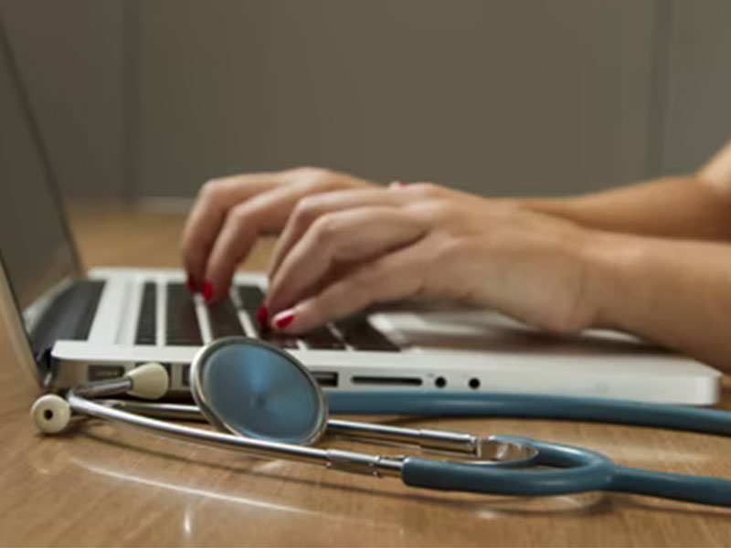 Person-using-a-Computer-with-a-Stethoscope